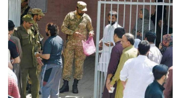 Polling process begins among tight security arrangements
