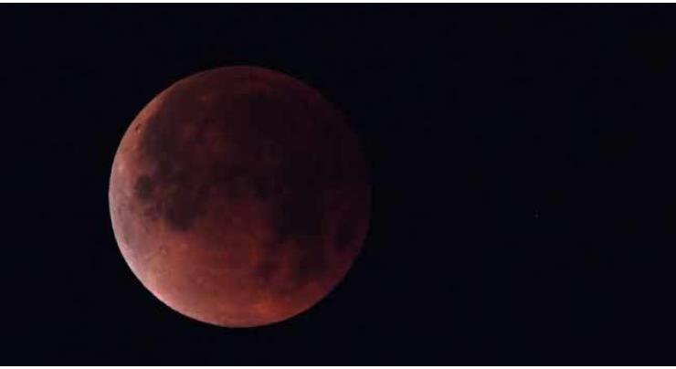 Red planet and 'blood moon' pair up to dazzle skygazers
