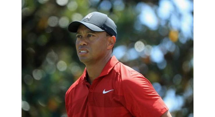 Storm-hit PGA resumes with Tiger chasing leader Woodland
