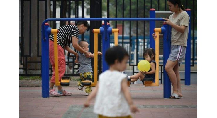 Given the right to larger families, Chinese may hold off
