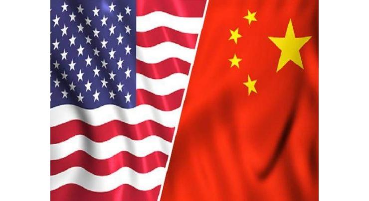 China warns of protectionism as US trade row simmers
