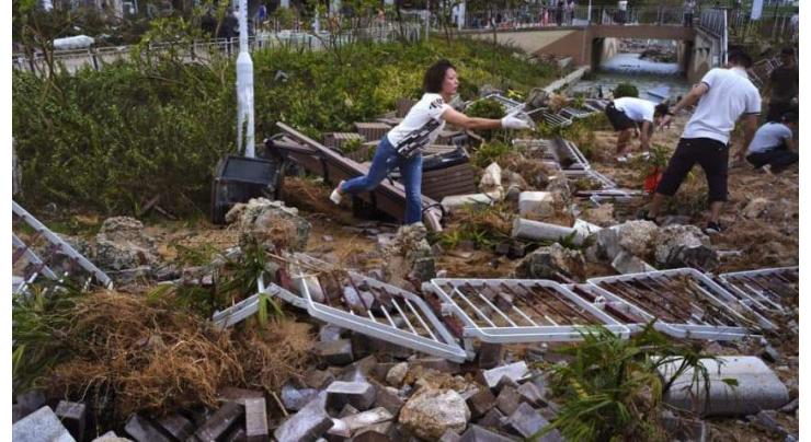 Massive clean-up in Hong Kong after typhoon brings trail of destruction
