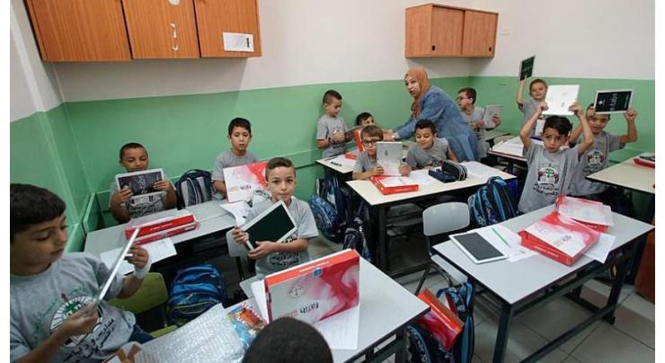 Turkish aid agency distributes android tablets in Palestine
