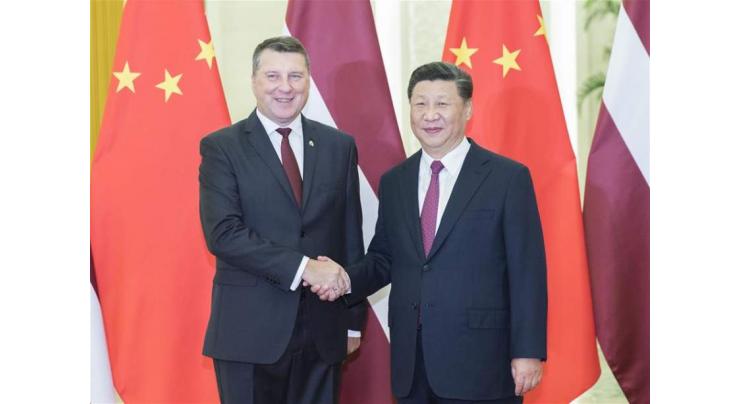Xi meets Latvian president
