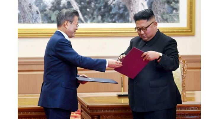 N. Korea's Kim says to visit Seoul, shut missile site
