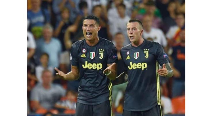 Ronaldo sent off but 10-man Juventus ease past Valencia
