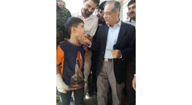 CJP gives love to injured boy donating for dams fund in DHQ Hospital, Chitral