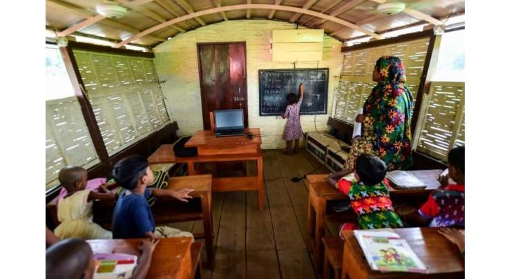 Bangladesh kids turn the tide on climate change aboard floating schools
