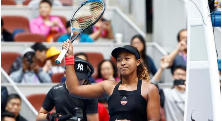 Quickfire Osaka charges into Beijing last eight
