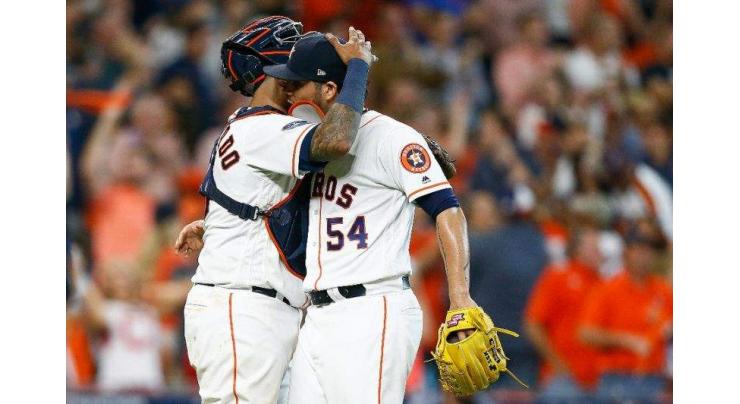 Astros belt four home runs, beat Indians in playoff opener
