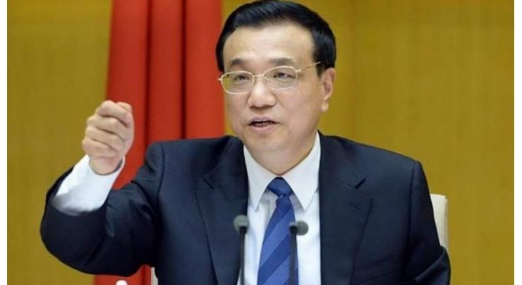 Chinese premier urges protection of free trade as US spat grows
