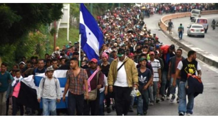Honduran migrants defy Trump to continue long march north
