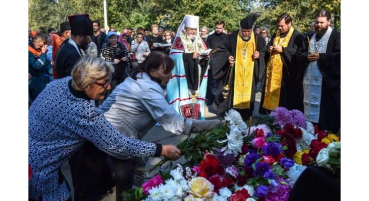 Tears, confusion as Crimea mourns college shooting
