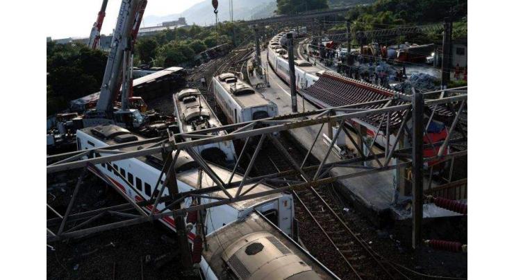 Taiwan investigates train crash that killed 18
