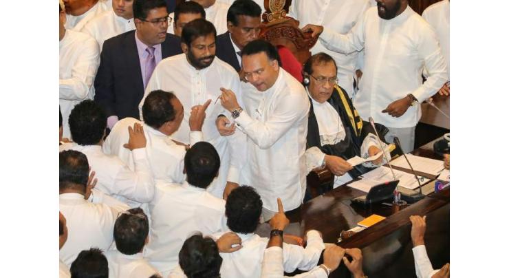Punch-up in Sri Lankan parliament as thousands rally
