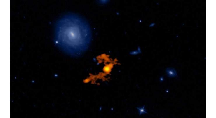 Astronomers see how brightest galaxy eating its neighbors
