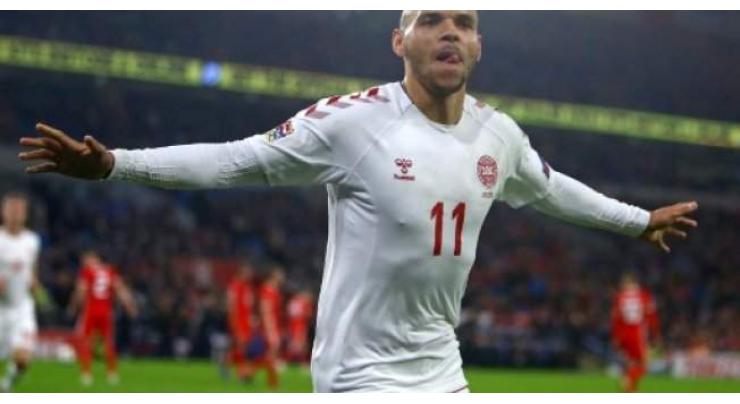 Denmark gain Nations League promotion with Wales win
