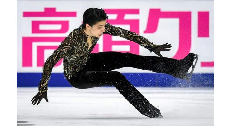Two-time Olympic champion Hanyu survives fall to win in Moscow
