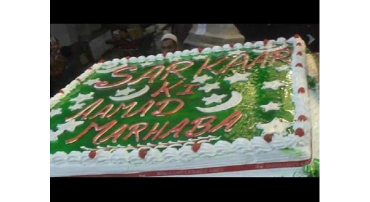Milad-Cake cutting a 63-pound cake at Chowk Clock Tower in Faisalabad
