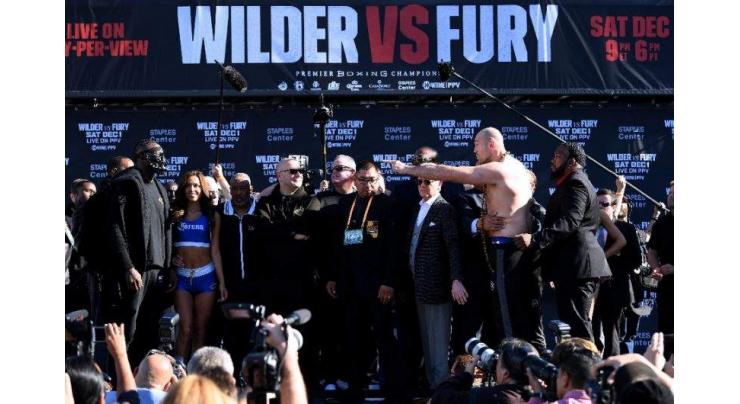 Wilder vows to knock out Fury at heavyweight title weigh-in
