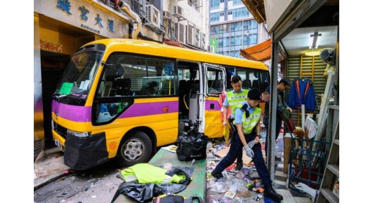 Four killed as Hong Kong school bus mounts pavement, trapping passers-by
