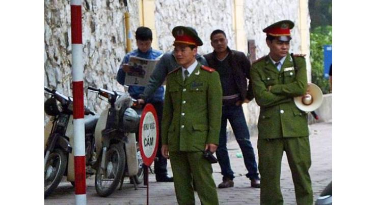 Vietnam probes former top policemen on fugitive spy links
