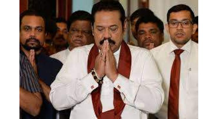 Rajapakse bows out, ending Sri Lanka power struggle
