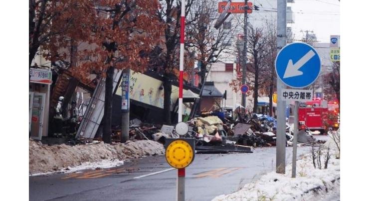 Japan police investigate cause of blast that hurt 42
