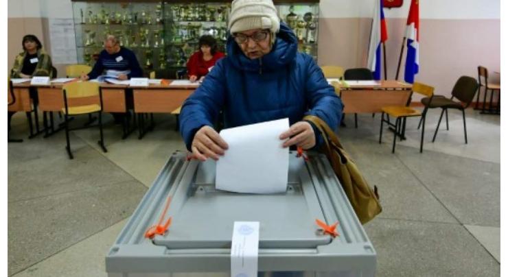 Fraud claims as Kremlin candidate wins vote re-run
