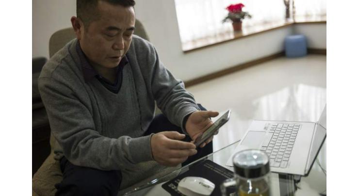 China's first 'cyber-dissident' faces trial
