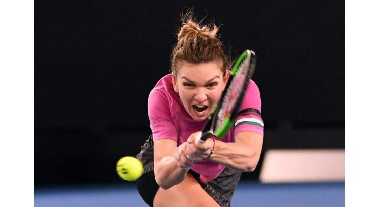 Top seed Halep cools Open expectations after early scare
