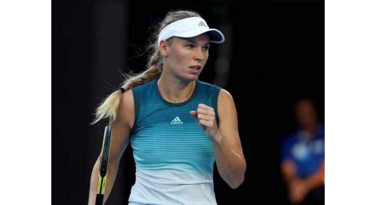 Defending champion Wozniacki storms into Open third round
