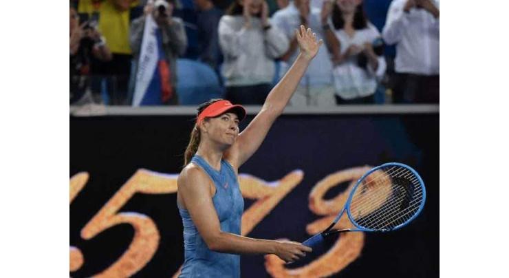 Dominant Sharapova win sets up Wozniacki clash
