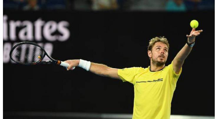 Former champion Wawrinka edged by Raonic at Open
