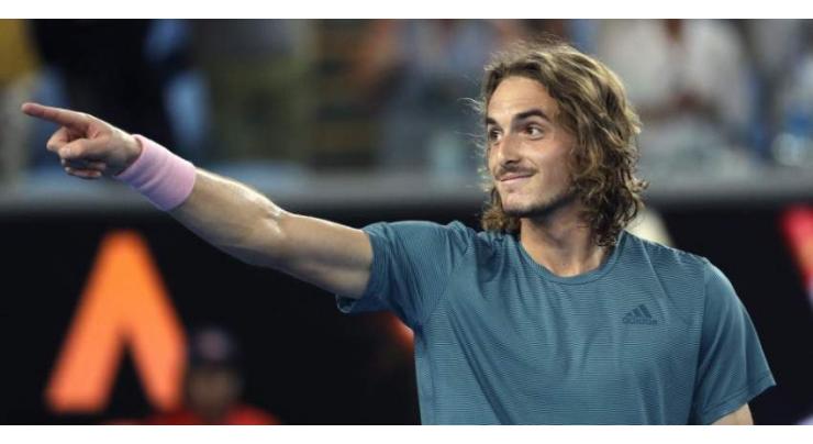 Tsitsipas eyes up Federer after rollicking victory
