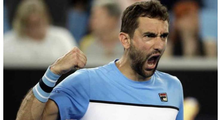 Cilic saves match points to reach Open last 16 in late-night drama
