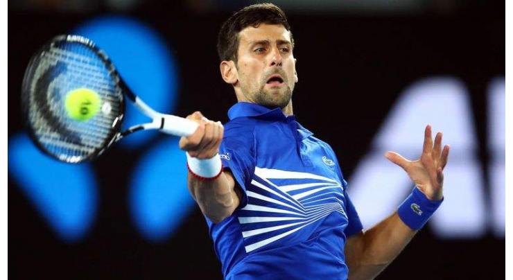 Djokovic into Open semi-final after injured Nishikori retires
