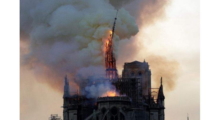 Workers questioned over Notre-Dame inferno as donations pour in
