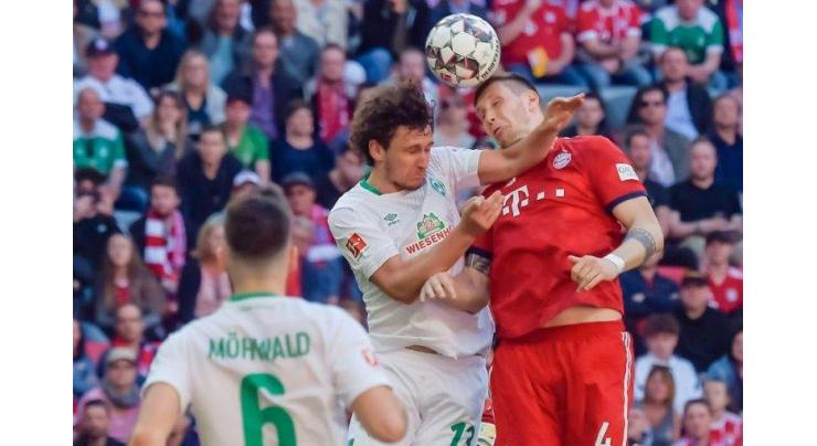 Bayern grind out Bremen win to stay ahead of Dortmund
