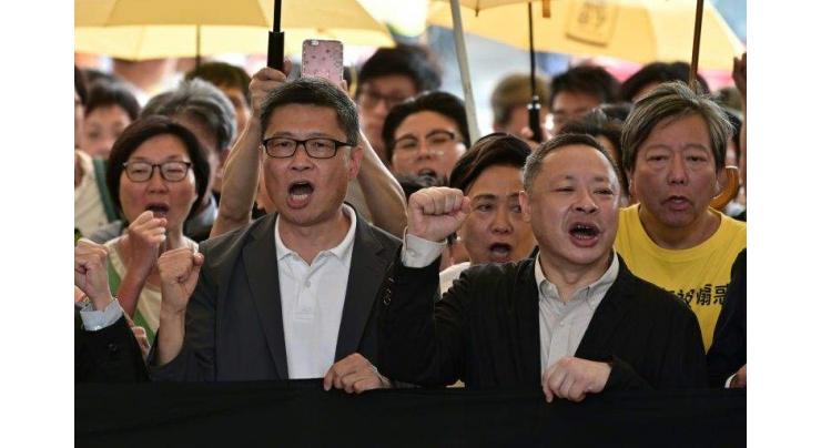 Hong Kong democracy leaders jailed over Umbrella Movement protests
