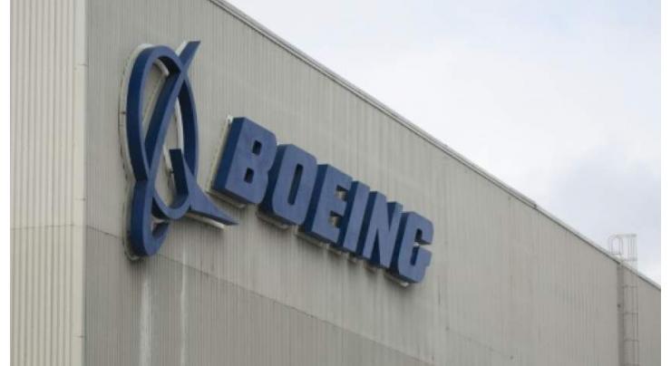 Boeing reports lower profits amid 737 MAX crisis
