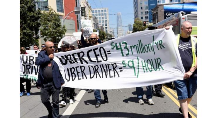 Rideshare drivers strike as Uber poised to go public

