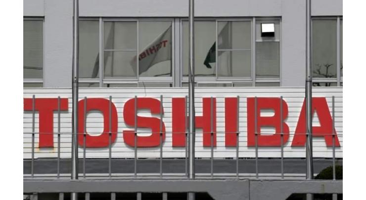 Toshiba net profit up on chip business sale
