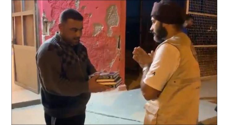 Sikhs win over hearts by distributing Quran copies at refugee camp