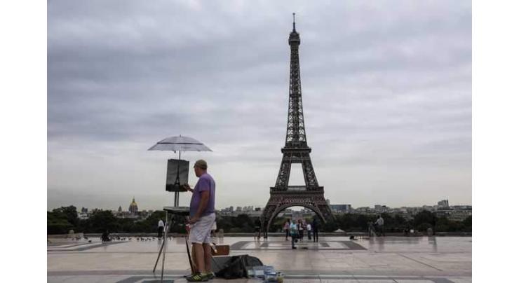 Eiffel Tower evacuated after climber spotted on monument
