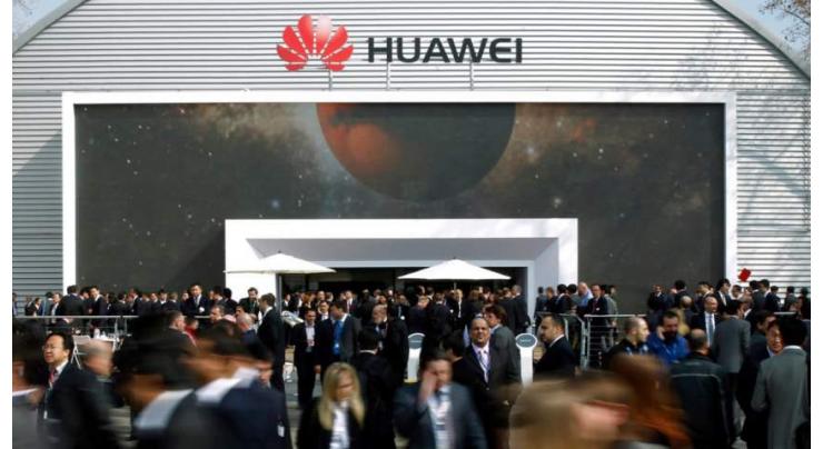 Asian markets mostly up but Huawei, trade war loom large
