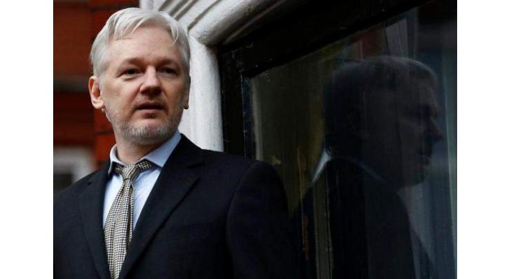 UK minister signs US bid to extradite Assange
