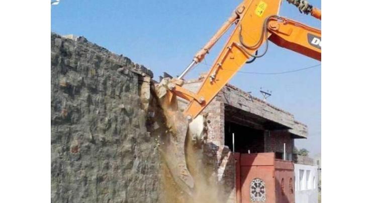 50 shops, houses demolished in anti-encroachment operation in Peshawar

