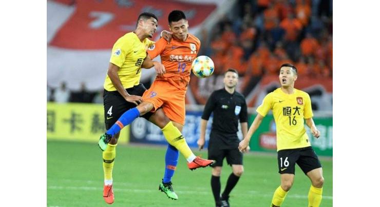 Penalty drama as Chinese giants Evergrande reach Asia's last eight
