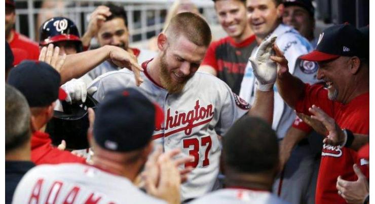 Strasburg shines at the plate as Nationals beat Braves
